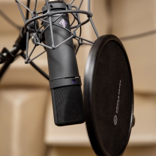 Close-up of a microphone in a recording studio.